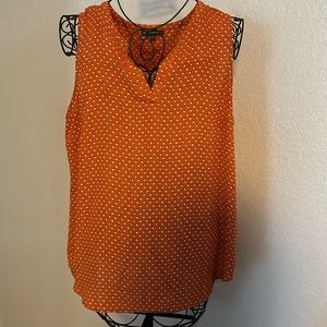 Sleeveless orange blouse